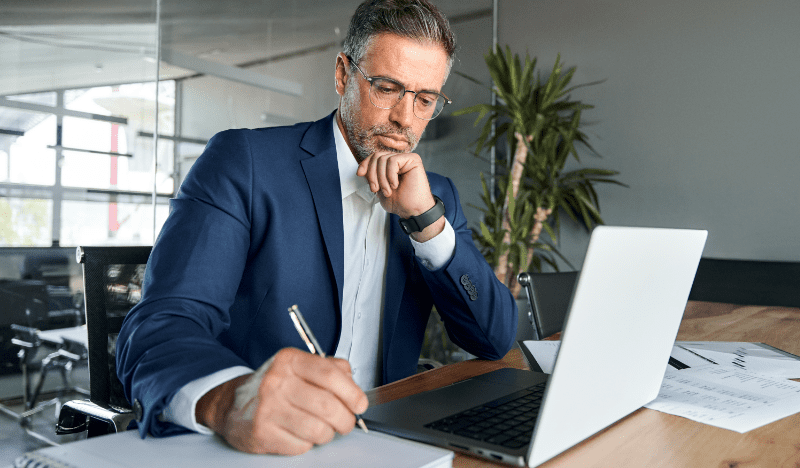 Business Man at a Desk in a Suit
